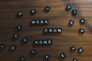 work from home written in black scrabble letters on wood table