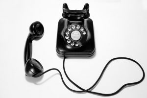 corded black rotary phone